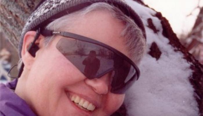 Woman's face wearing sunglasses