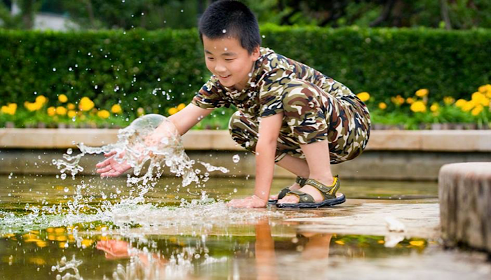 Justin splashing in the water