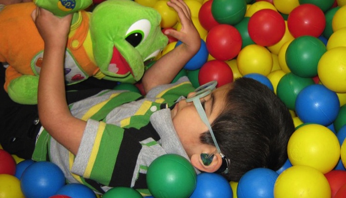 Little boy in ball pit