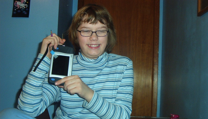 child with handheld CCTV