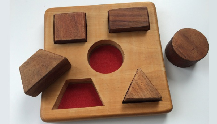 wood puzzle with red felt added