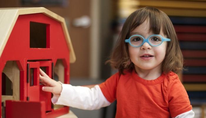 little girl wearing glasses