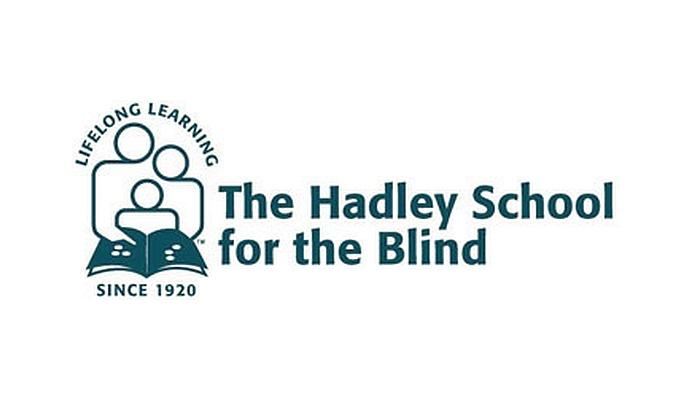 Hadley logo: stick outline of two parents reading to child.