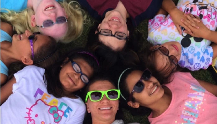 kids laying in a circle