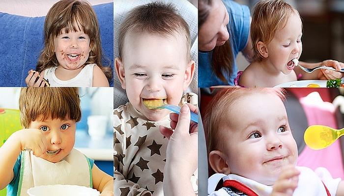 Happy young children eating