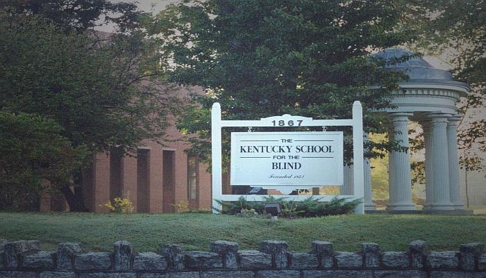 Sign for Kentucky School for the Blind in front of columned building