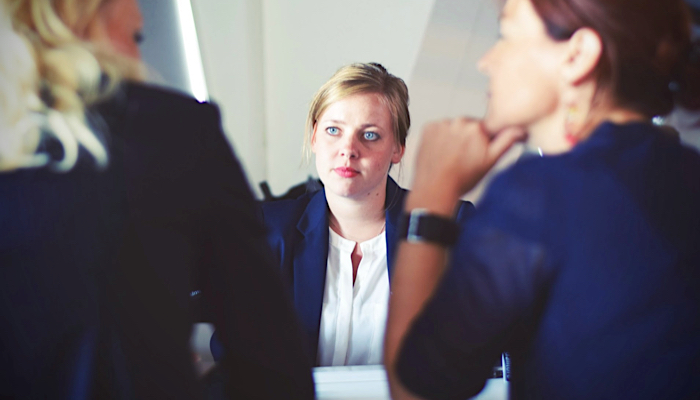 three women in a meeting