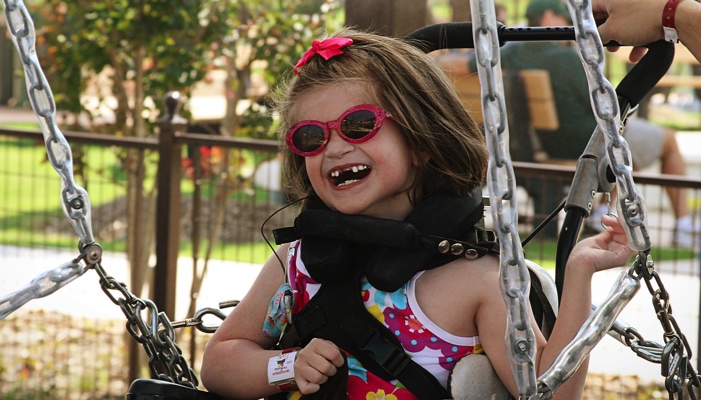 girl on a wheelchair swing