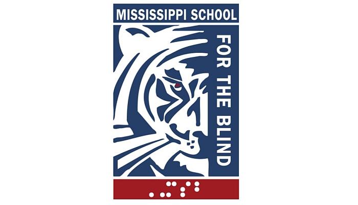 Block print of tiger face with school name