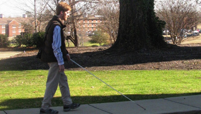 man walking with a cane