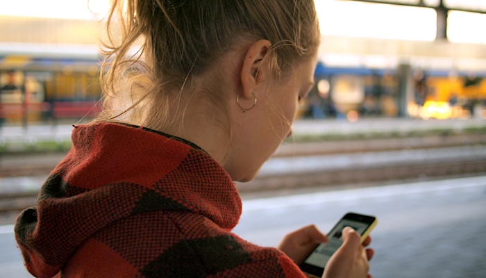 woman on her smart phone