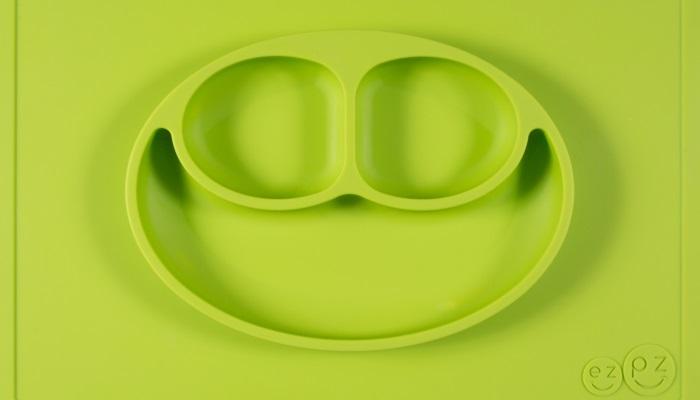 lime green divided dish on mat