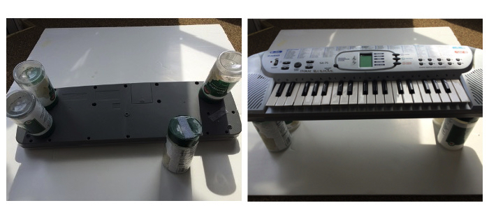 parmesan cheese containers added to make legs on a keyboard