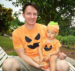 Ivan and dad dressed as pumpkins