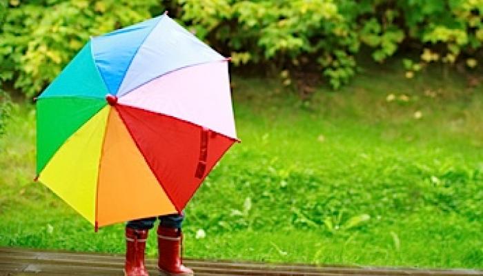 Little girl with a rainbow umbrella