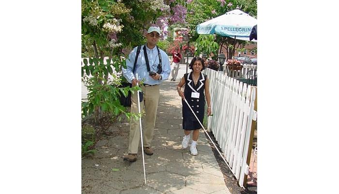 Holding a white cane