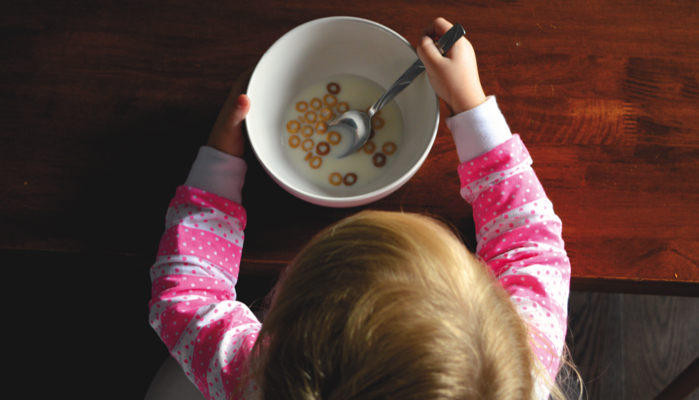 child eating with a spoon