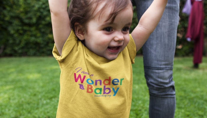 I am a WonderBaby t-shirt on a smiling little girl