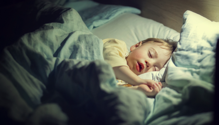 boy sleeping in bed