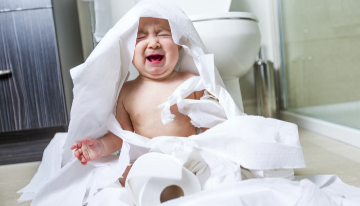 baby crying with toilet paper