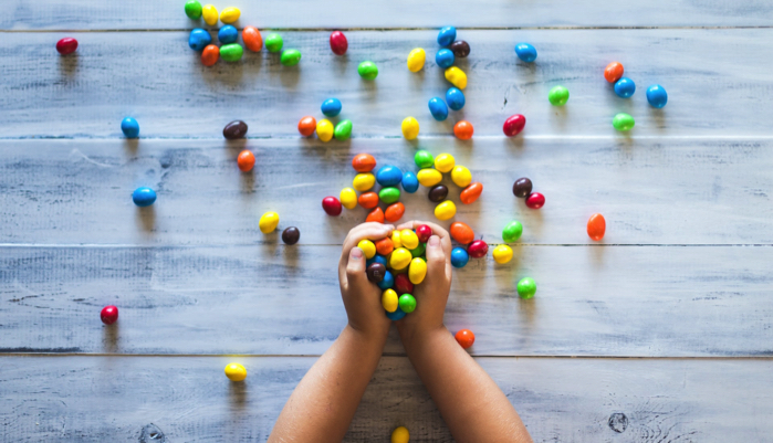 a child grabbing candy