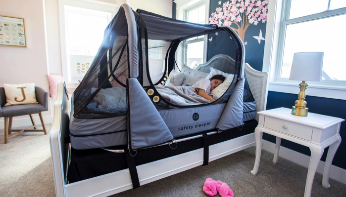 girl sleeping in her Safety Sleeper