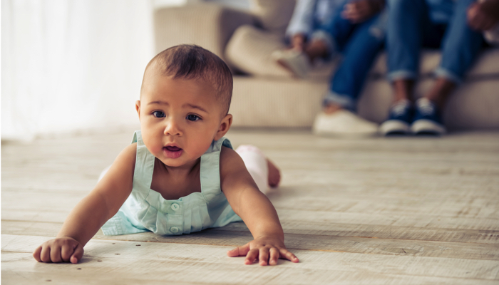 baby crawling on belly