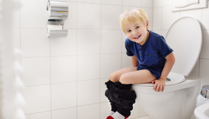 boy sitting on potty