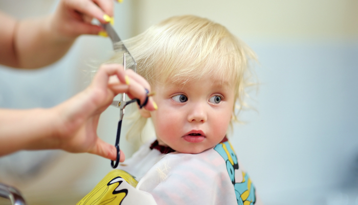 baby getting his hair cut