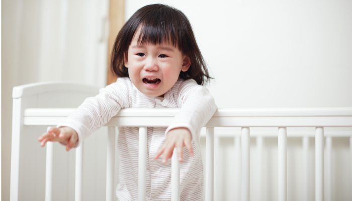 toddler crying in her crib