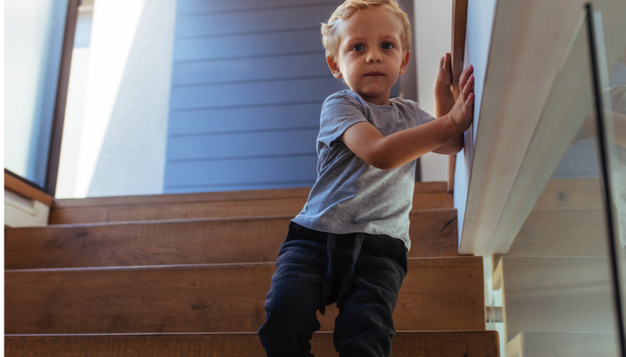 blind boy walking down stairs