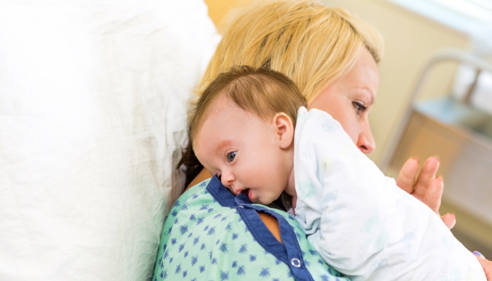 Mother burping her child.