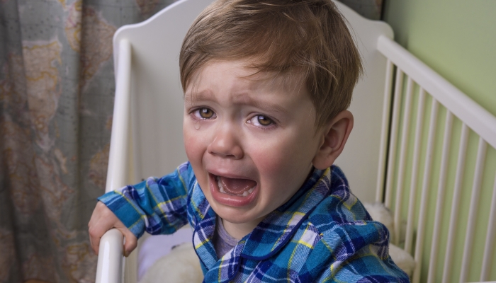 Newborn throwing tantrums in bed.