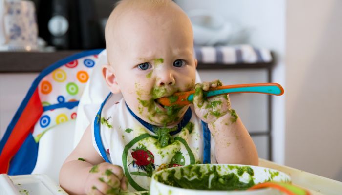 Messy baby eating.