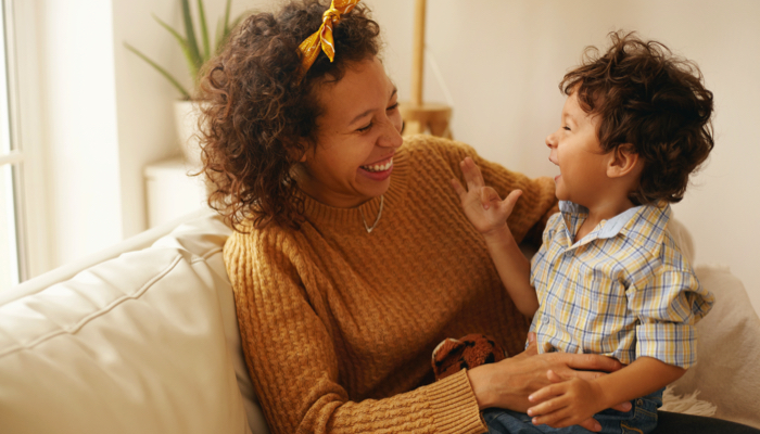 Mom and child smiling