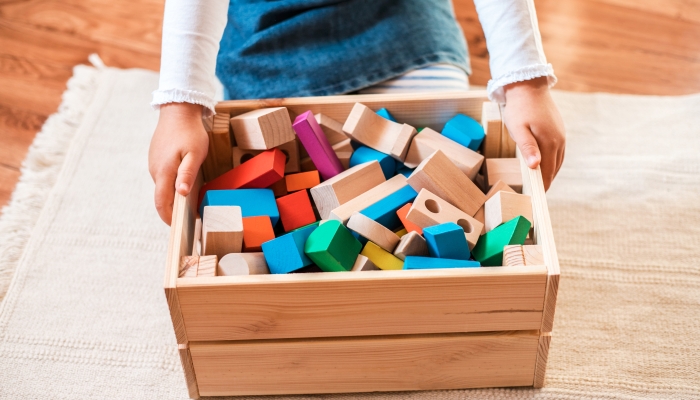 Wooden toys in a box.