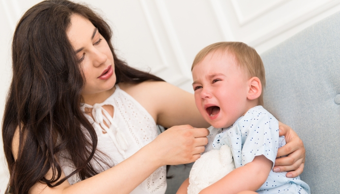 Baby having a meltdown with mom.