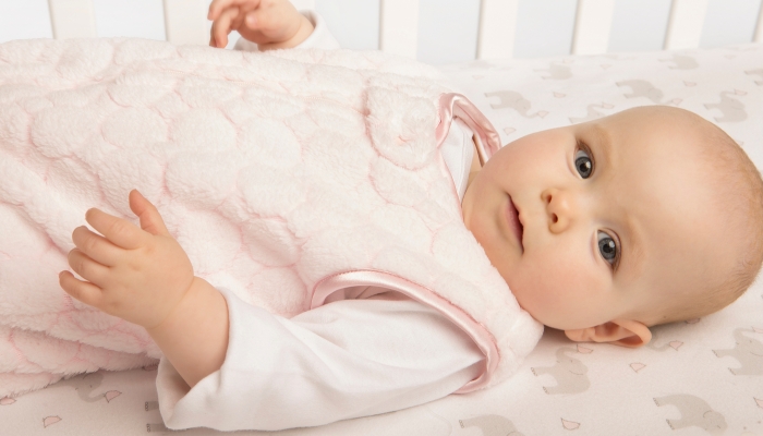 Baby in Cozy Pink Puff Sleeping Sack