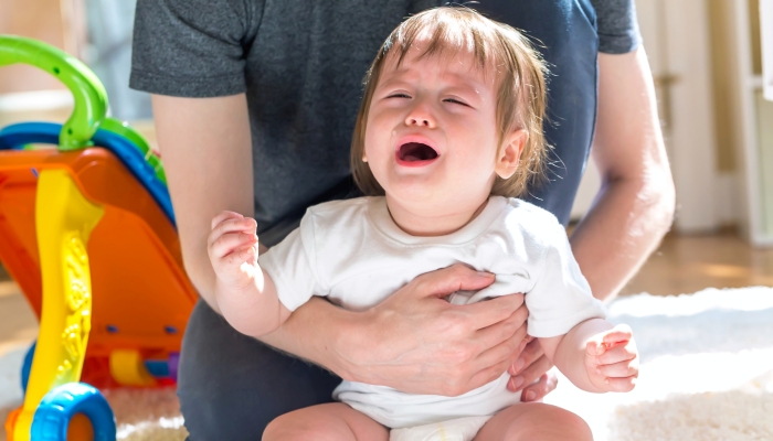 Upset toddler having a meltdown.