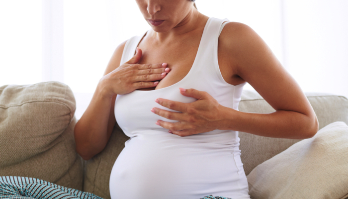 A woman having dry nipples during her pregnancy.