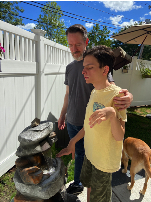 Ivan and his dad at the water fountain.