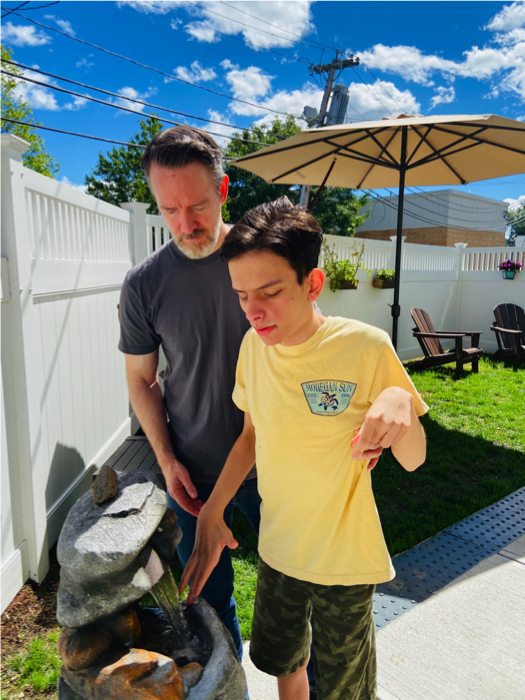 Ivan and his dad at the water fountain.