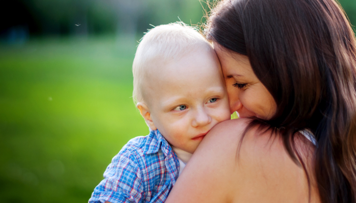 A mother holding her son.