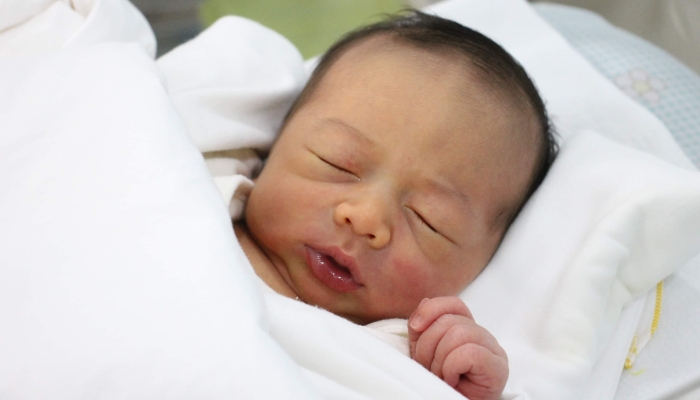 Close up of newborn baby face.