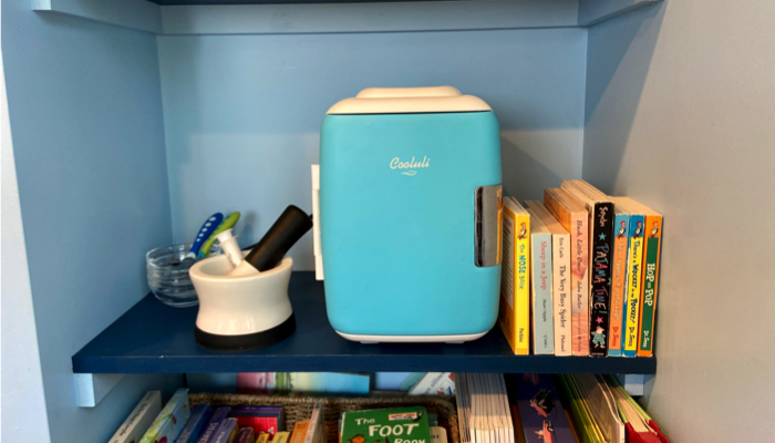 Our Cooluli mini fridge on a box shelf.