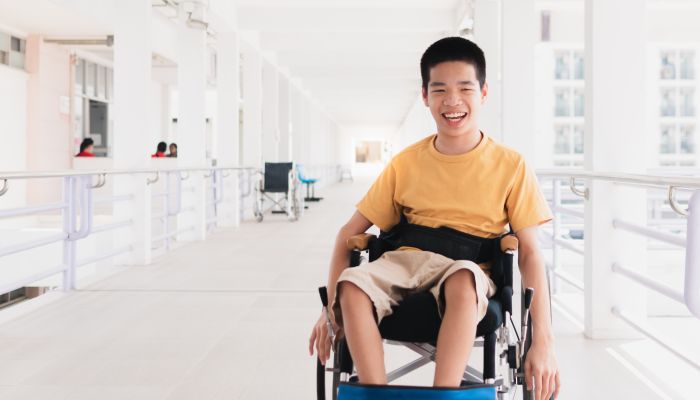Special needs boy in wheelchair.