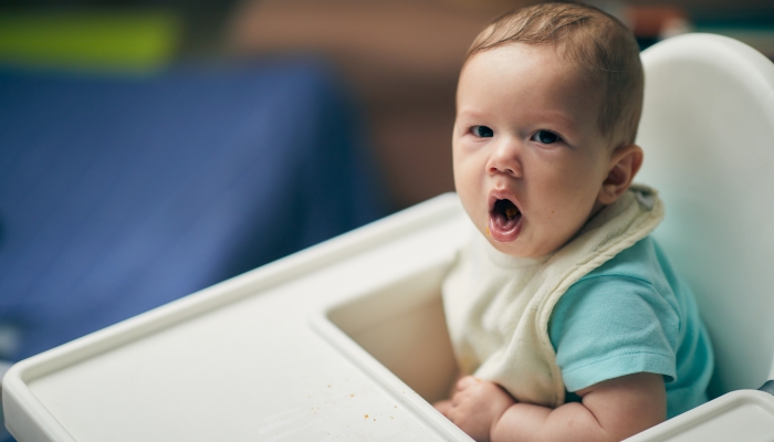 6 months old cute Caucasian and African mixed race baby coughing