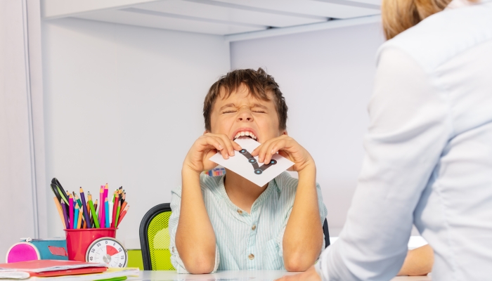 Autistic child bite card expressing negative emotions and throwing tantrums.