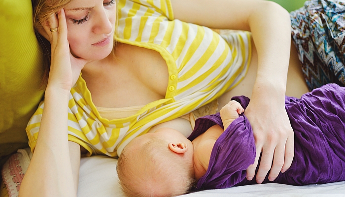 Breastfeeding of newborn.