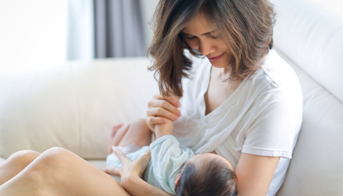 Mother breastfeeding to baby.